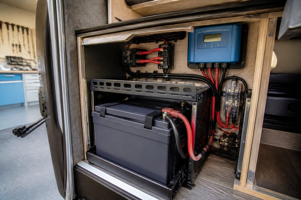 Lithium battery and MPPT controller installation in a campervan, demonstrating Renogy vs Ecotree setup quality.