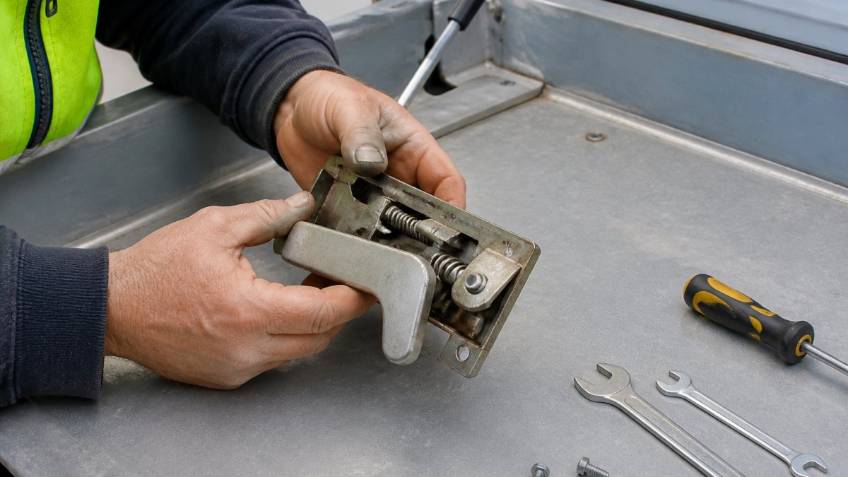 Step-by-step guide illustrating the replacement process of a metal roof hatch locking mechanism