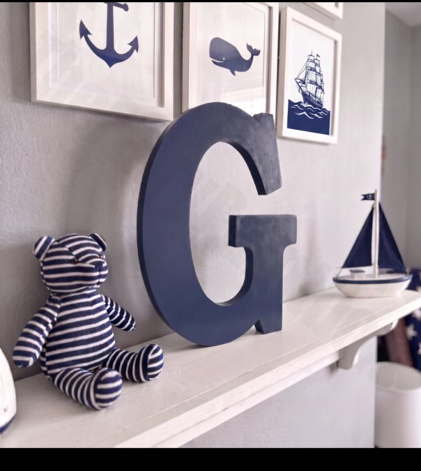 Navy blue wooden letter monogram in nautical nursery room