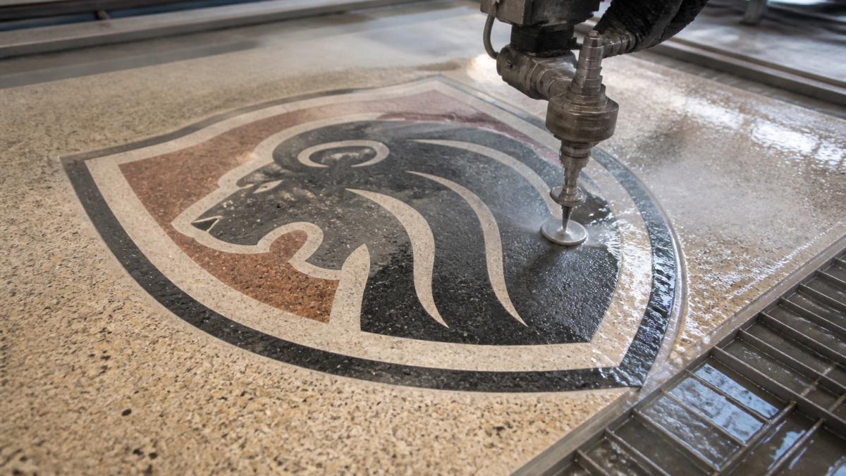 Waterjet cutting process for precision school logos terrazzo flooring installation