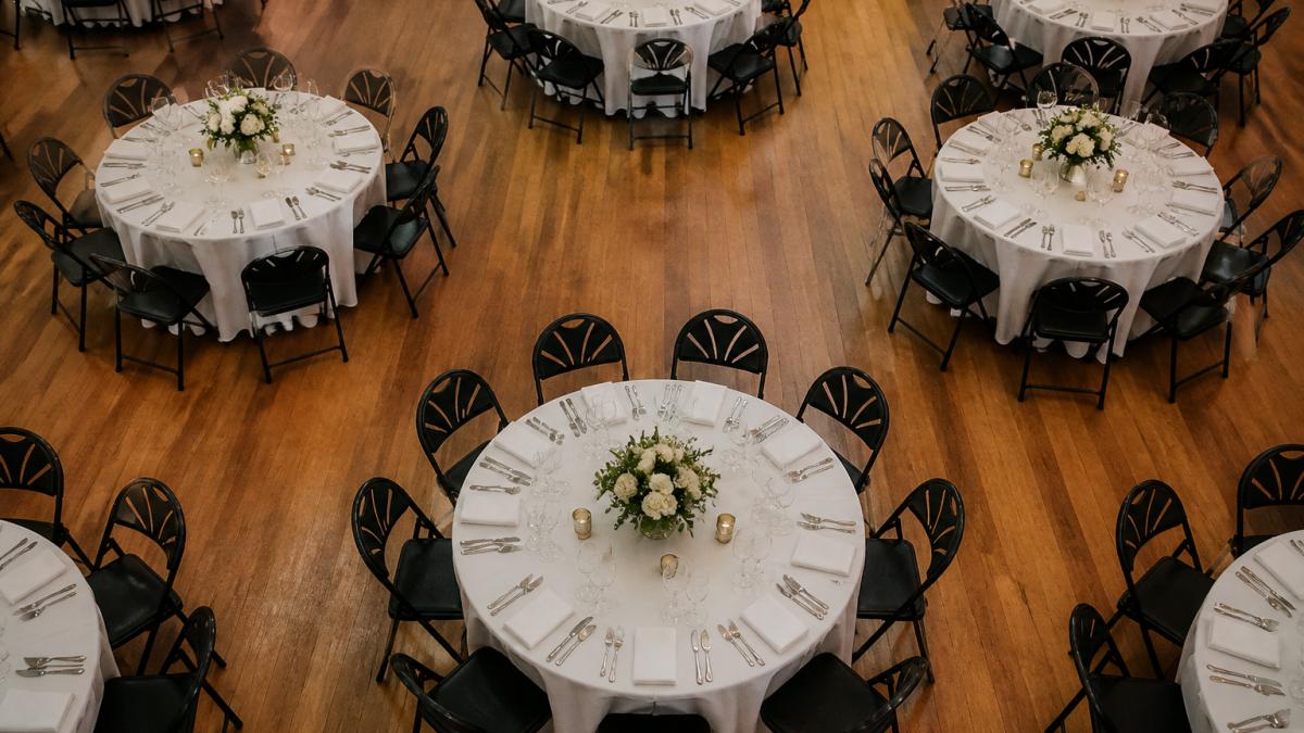 Diagram of a symmetrical banquet hall layout for a seamless event setup with round tables and chairs.