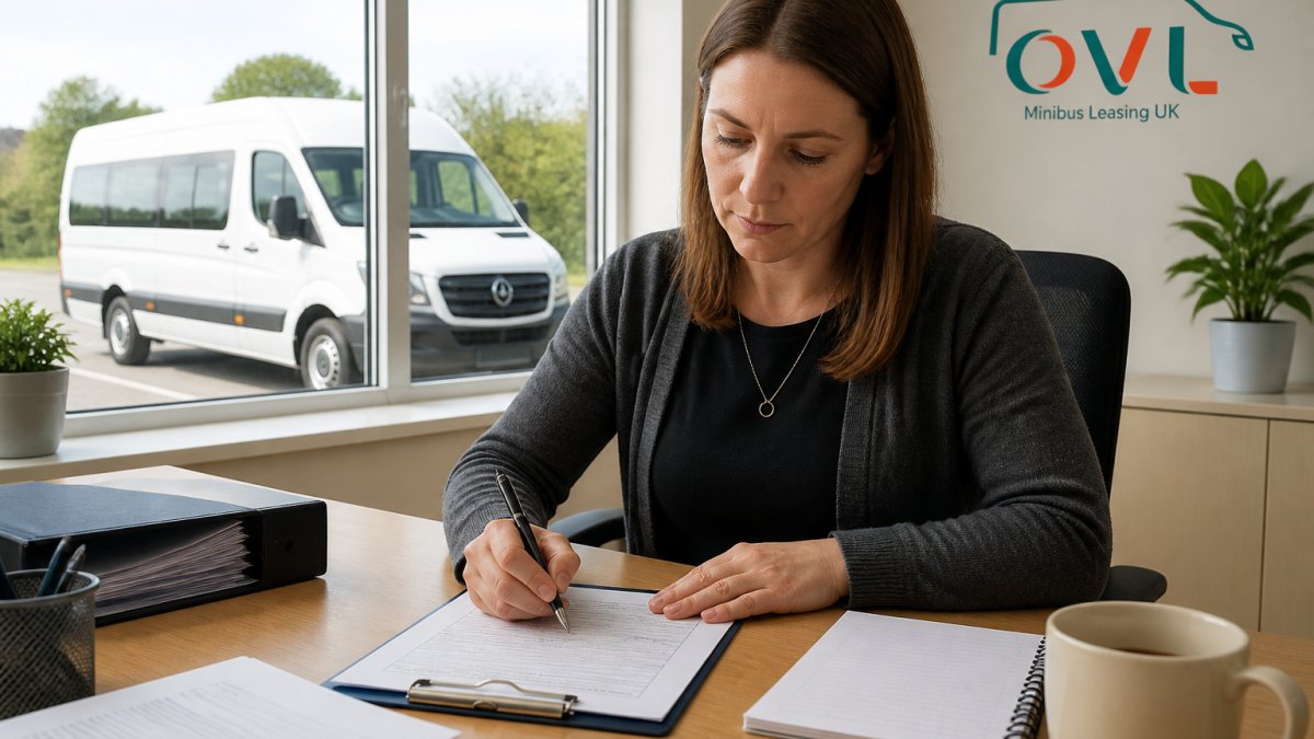 A charity administrator in a bright office completing a paper permit application form at a desk, with a white minibus visible through the window outside