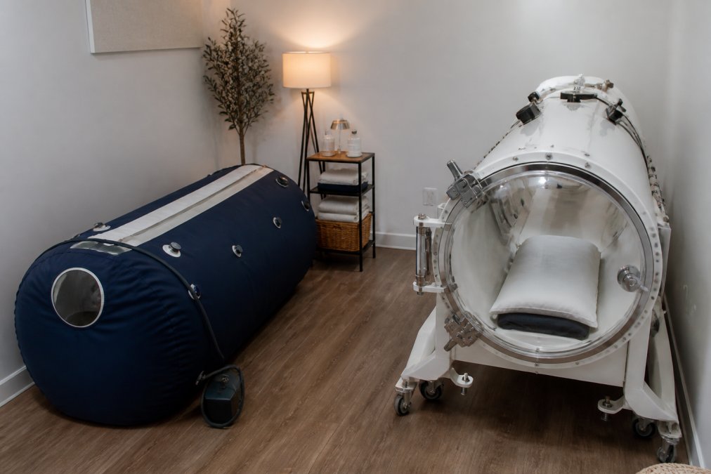 Soft shell and hard shell hyperbaric units in a wellness clinic to illustrate chamber performance differences.
