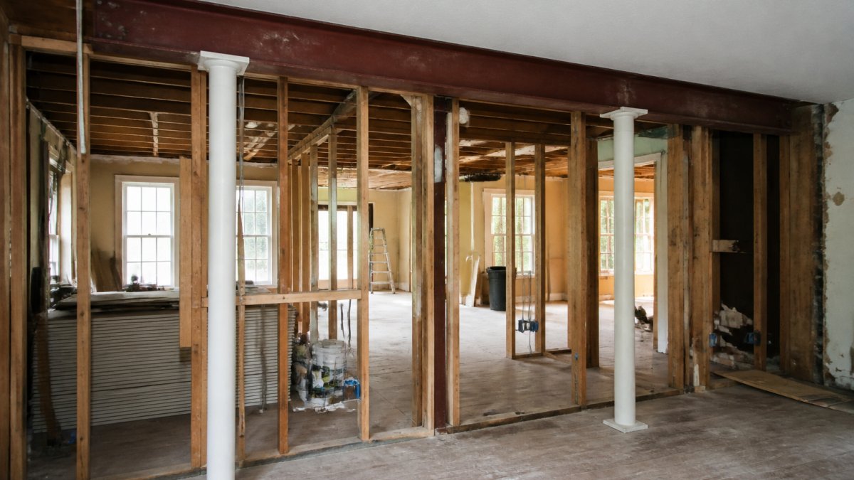 Diagram showing the load-bearing wall removal process managed by structural renovation specialists