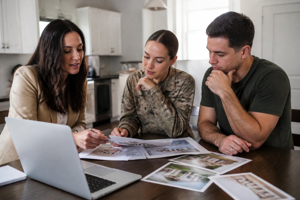 Process infographic for a military couple reviewing Sumter SC residential property listings at a kitchen table.