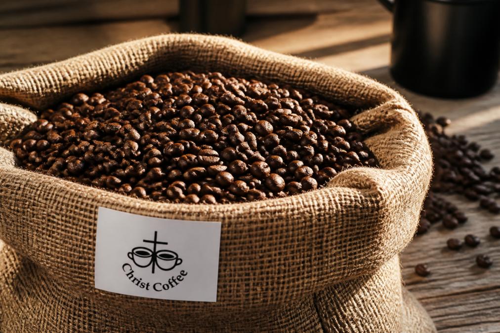 Close-up of freshly roasted specialty coffee beans in a burlap bag with a shipping label, morning sunlight streaming across the surface, revealing the rich brown color and texture of the beans