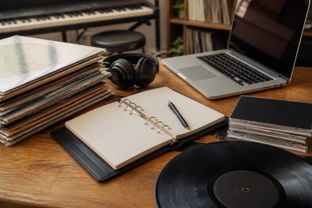 Label manager comparing music catalog management platforms and royalty reporting tools