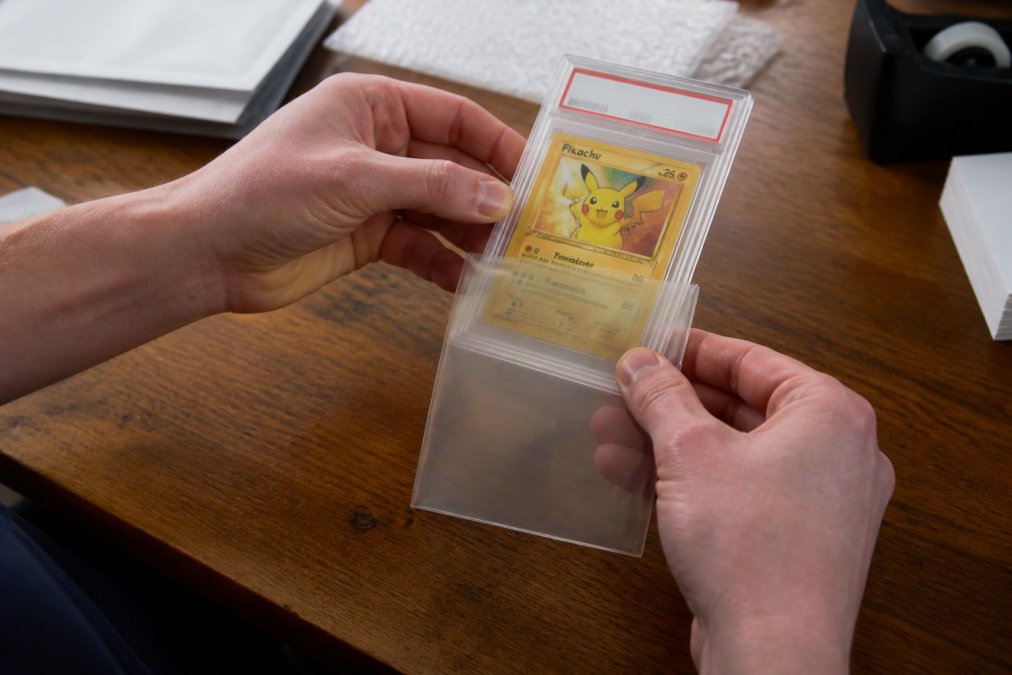 Step-by-step guide on using protective sleeves to follow our trading card return policy for safe shipping.