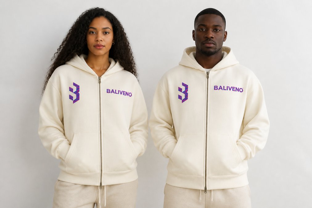 Two people of different body types wearing the same oversized unisex hoodie, showing how the relaxed silhouette adapts to various frames with natural studio lighting