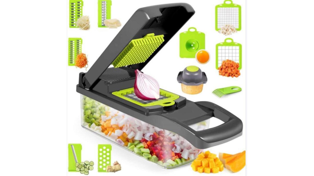 A flat lay of seven kitchen gadgets arranged on a clean white marble counter: a vegetable chopper with diced onions, a digital spoon scale, a heat-resistant drainage basket, a stainless steel thermal bottle, folded beeswax cloths in honey and lemon patterns, a linen bread bag with a sourdough loaf, and a copper chain wine rack holding a bottle