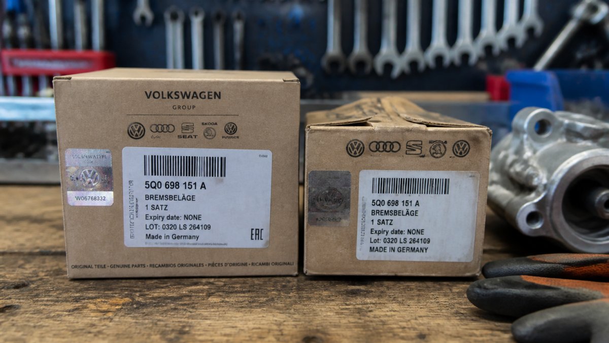 Close-up of authentic VW part packaging with sharp holographic label, clear part numbers, and precise printing next to counterfeit packaging with blurry text and misaligned design elements