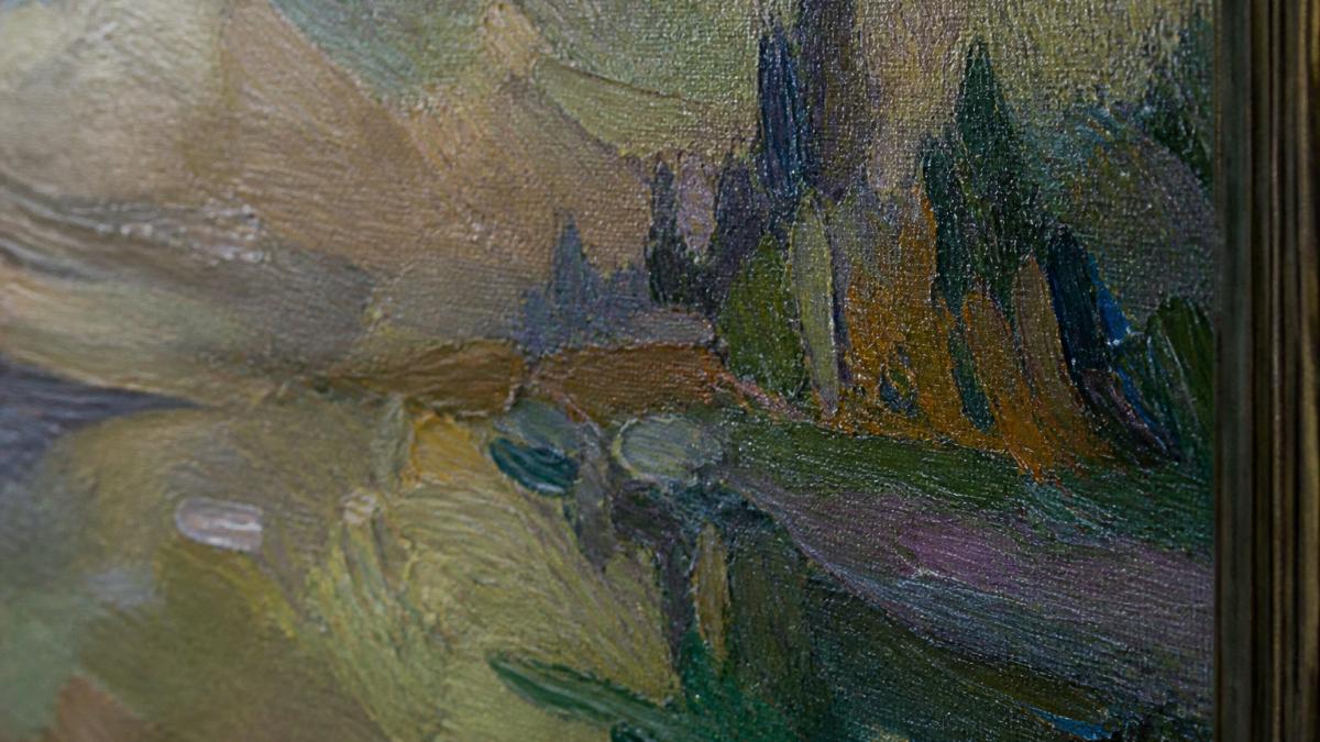 Close-up of an original oil painting showing visible brush strokes, texture variations, and artist signature in corner on canvas surface with natural side lighting