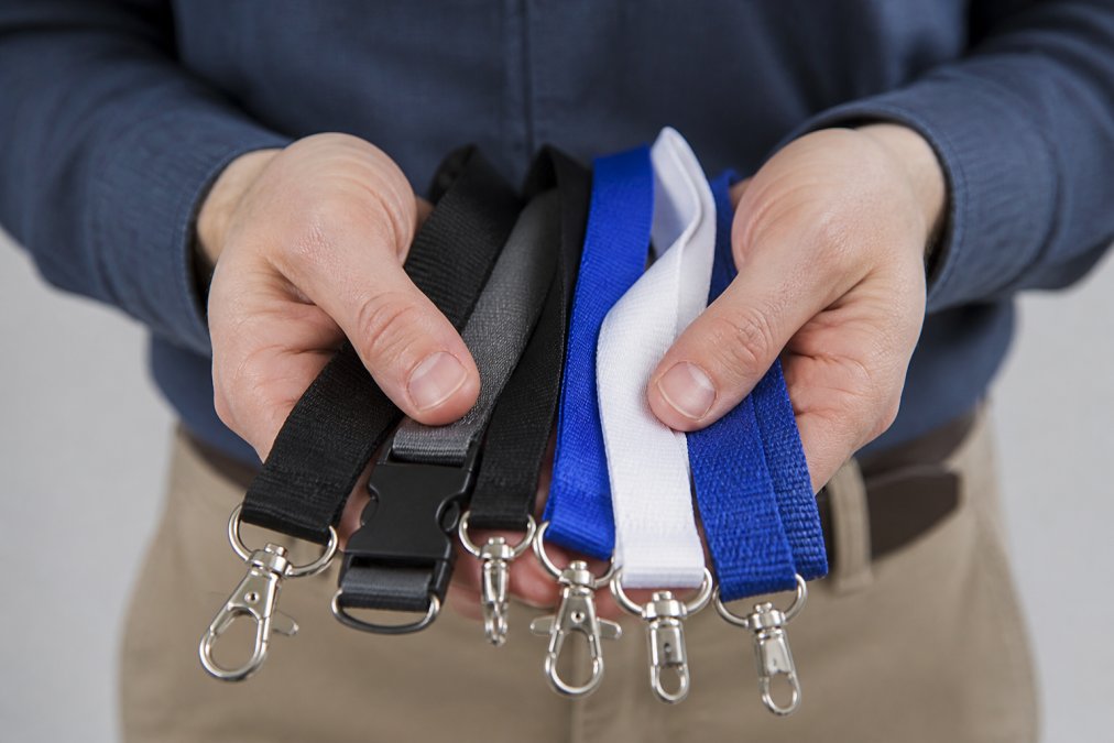 Infographic comparing the material textures and attachment clips of various custom lanyards