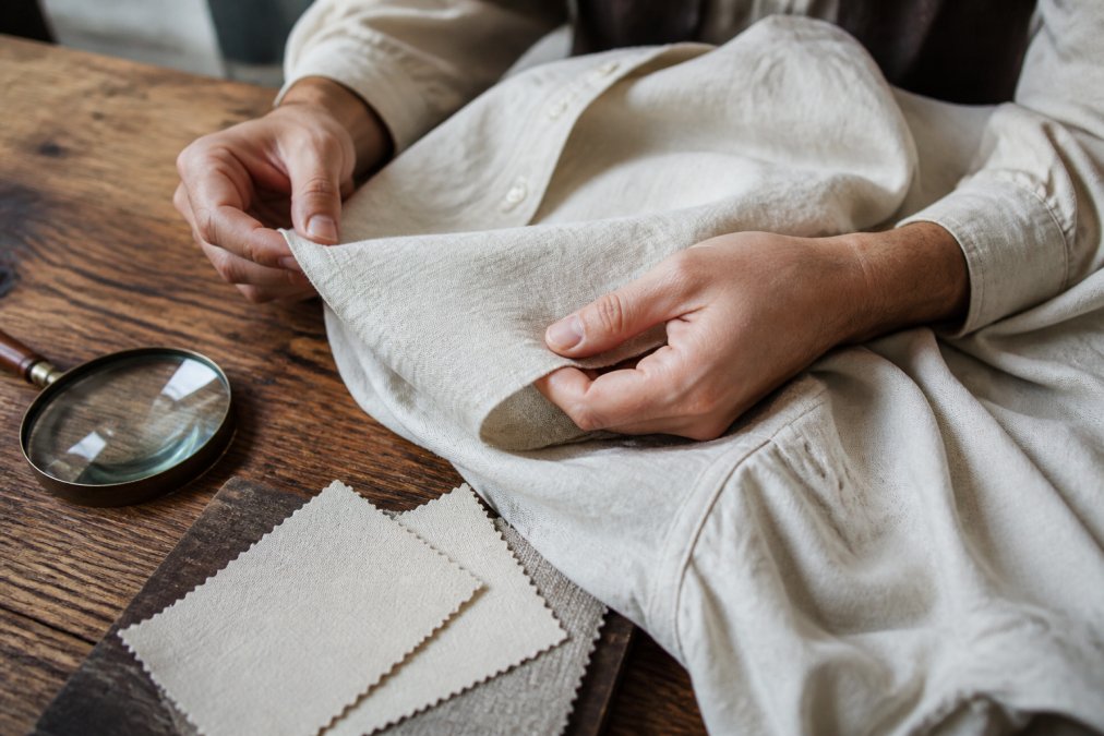 Step-by-step process for inspecting the weave and stitching of authentic historical shirts using fabric swatches