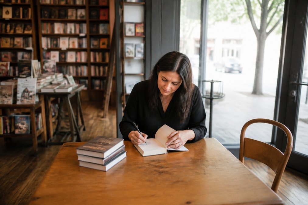 Infographic process for when book launch events fail, featuring an author at a quiet, empty signing table.