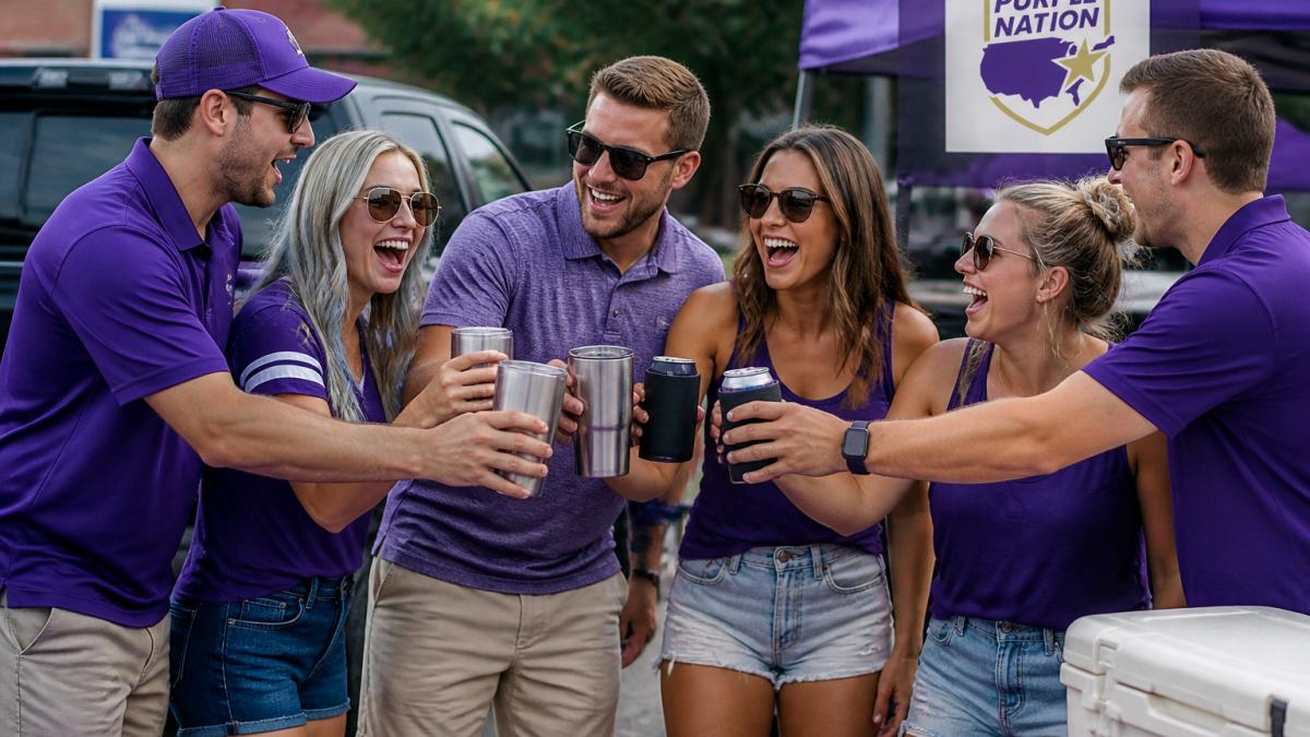 JMU fans wearing purple apparel cheer at a tailgate party while holding stainless steel drink tumblers