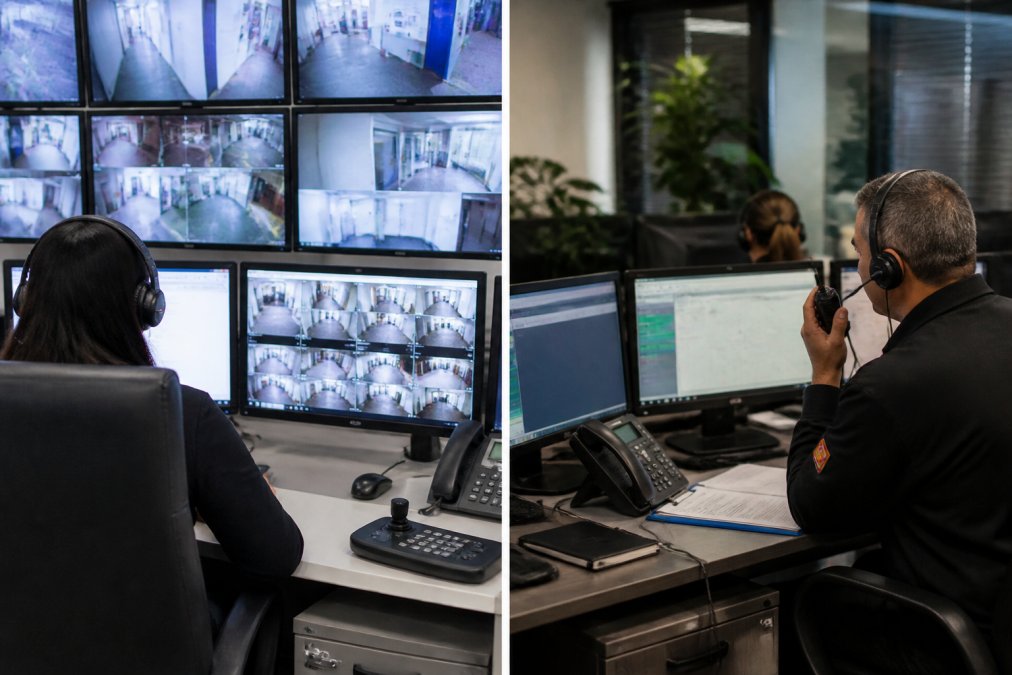 Security control room with multiple monitoring screens displaying live CCTV feeds, dispatch staff in communication headsets coordinating incident response with radio equipment, professional monitoring centre environment