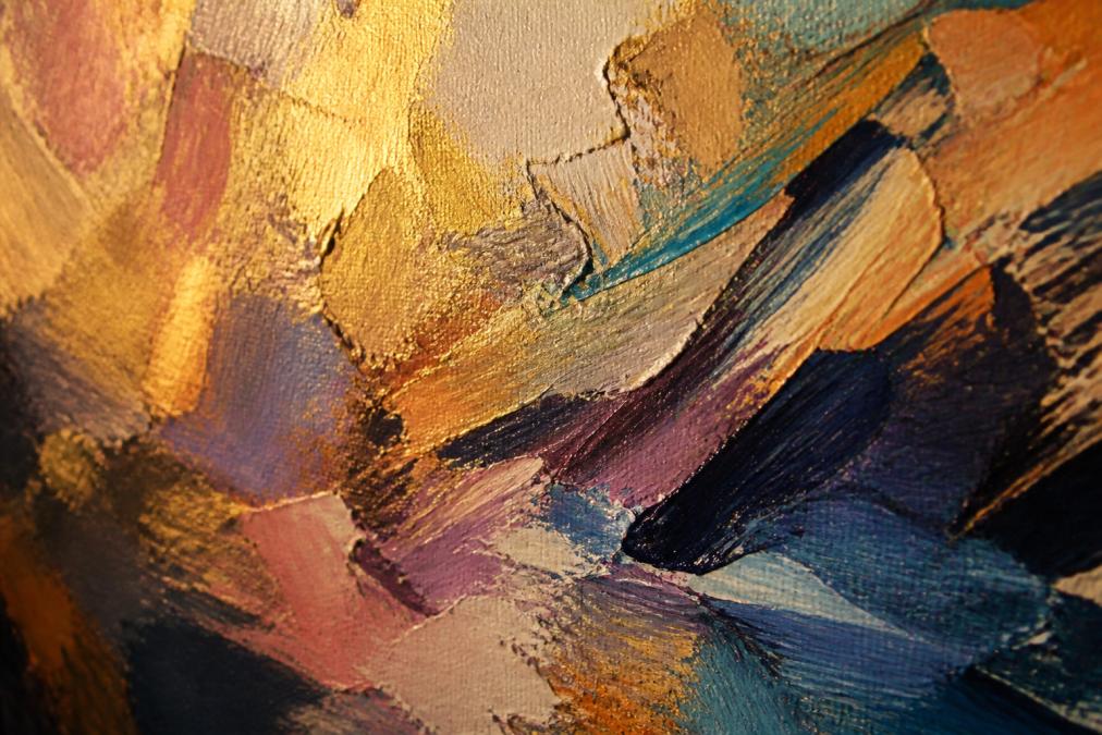 Close-up of an abstract painting showing rich, layered brushstrokes with dimensional texture, warm light highlighting the paint's depth and luminosity on canvas