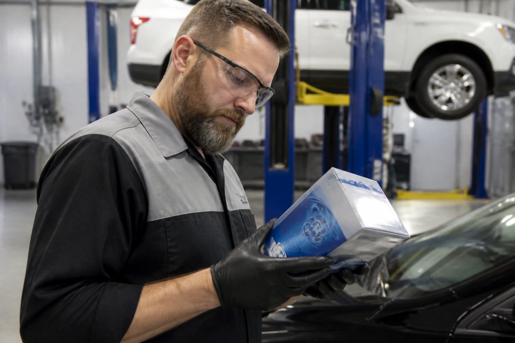 Professional illustration showing certified and technician and clean concepts for genuine GM parts