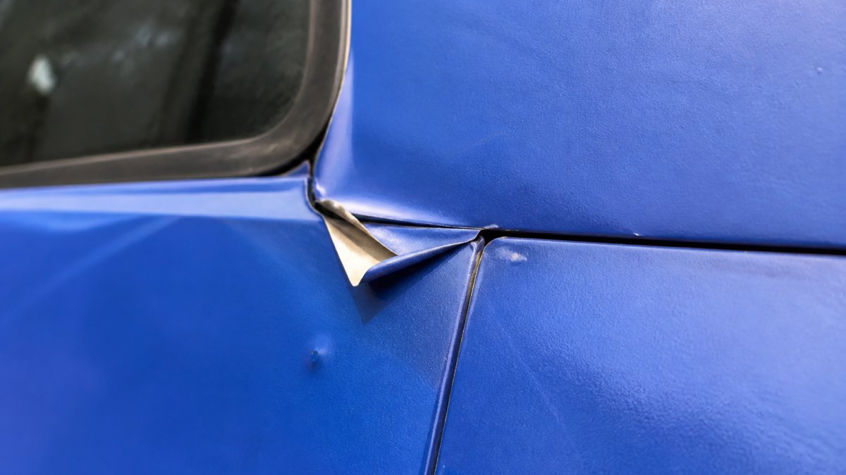 Diagram showing how vehicle wraps peel starting from edge lift, corner seams, and recessed areas.